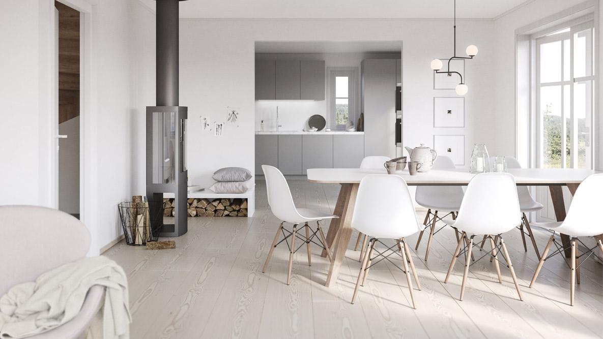 Kjøkkenbord med hvite stoler, en peisovn til venstre og innerst er det store kjøkkenet
